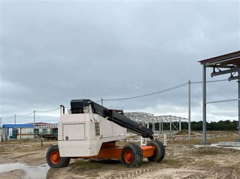 Small Truck with Loader Crane for Unloading Construction Materials at a Construction Site ...