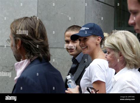 Lachlan Murdoch walks a perspirating Sarah Murdoch to the Westin Hotel ...