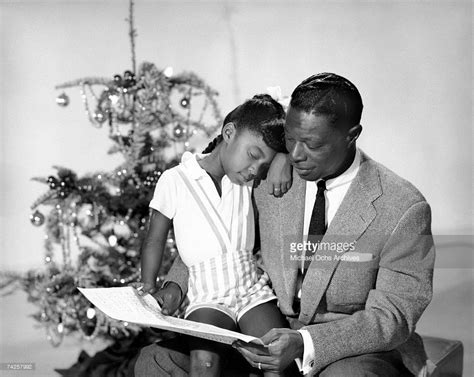 Singer Nat "King" Cole and his daughter Natalie Cole pose for a ...