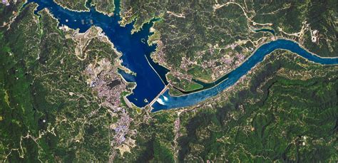 NASA images show flood water spilling from Yangtze river dams