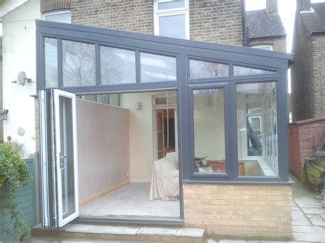 A lovely lean-to aluminium conservatory with a tiled solid roof and a plastered finish inside ...