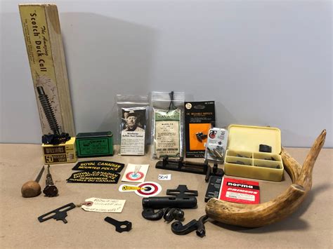 BOX LOT OF FIREARMS ACCESSORIES & COLLECTIBLES