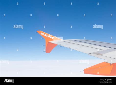 Easyjet airplane plane wings logo orange blue sky Stock Photo - Alamy