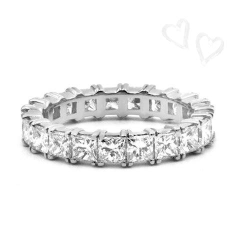 Princess cut diamond eternity band is stunning. Low profile with a prong on each corner, this ...
