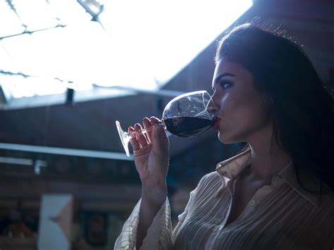 Girl drinking red wine from a glass 4901204 Stock Photo at Vecteezy