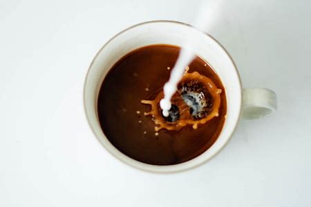 Royalty-Free photo: Photo of hot coffee on coffee seeds | PickPik