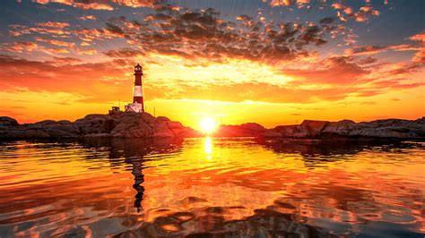 Lighthouse Sunset Sunlight Ocean Rocks Stones Clouds HD wallpaper | nature and landscape ...