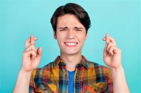 Photo of Crazy Scared Nervous Guy Crossed Fingers Wear Deer Ornament Sweater Isolated Green ...