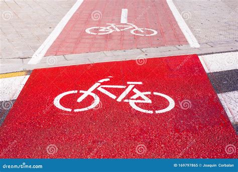 Signs and Bike Lane Markings Painted on the Asphalt of the Streets of ...