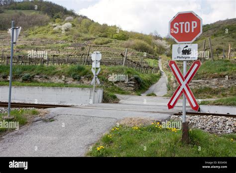 Stop sign at level crossing without barriers Stock Photo - Alamy