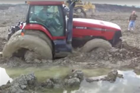 Tractor Stuck in the Mud Powers Its Way Through to Freedom | Engaging Car News, Reviews, and ...