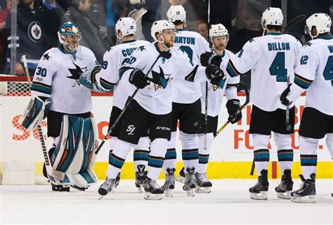 NHL Power Rankings: San Jose Sharks goalie Aaron Dell (30) celebrates ...