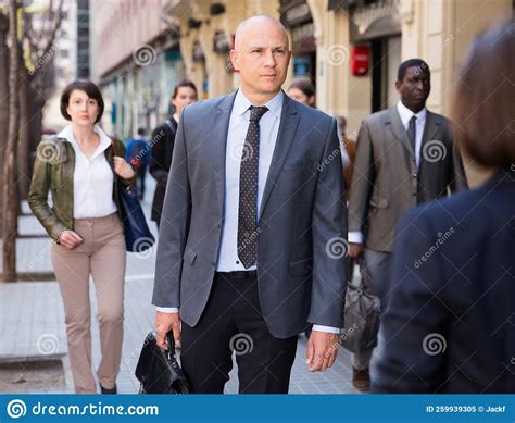 Businessman Walking on City Street Stock Image - Image of street, businessman: 259939305