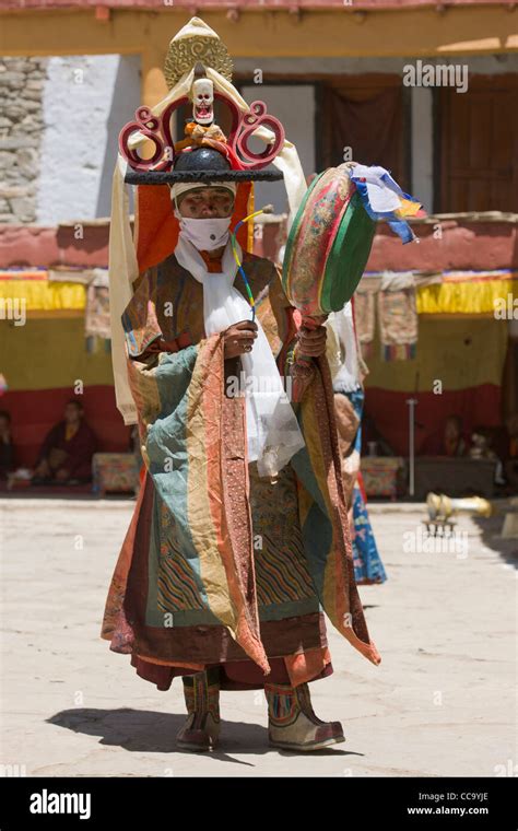 Cham dancer performing the Black Hat Dance (shana) with a drum in the ...