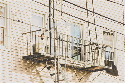 Suspended balcony and fire escape ladder on the... — Photo — Lightstock