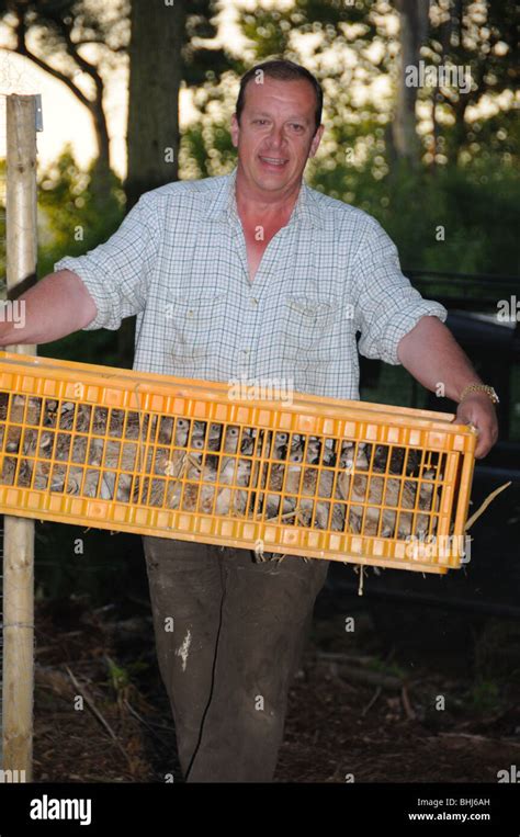 A gamekeeper with pheasants Stock Photo - Alamy