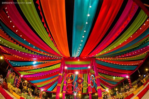 Indian wedding backdrop ideas. Colorful. Mela themed. Colorful woollen thread hanging for th ...