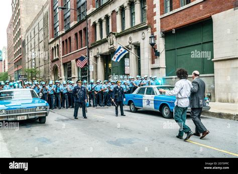 THE TRIAL OF THE CHICAGO 7, right with backs turned (from left): Sacha Baron Cohen as Abbie ...