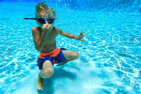 Little Boy Swimming Underwater Stock Image - Image of tropical, playful ...