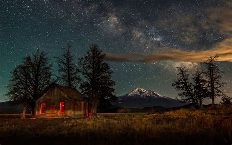 Download Starry Sky Night Sky Winter Snow Mountain Landscape Man Made Cabin HD Wallpaper