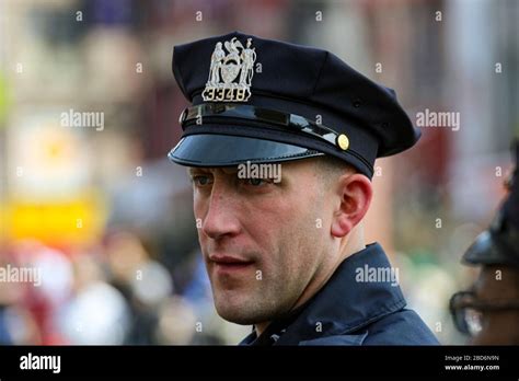 NYPD police officer with peaked cap in Manhattan; New York City, United States of America Stock ...