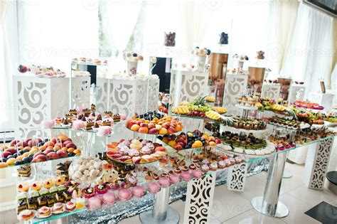 Beautiful wedding candy bar with sweets, fruits and food. Wedding banquet table 12866589 Stock ...