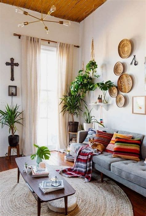 Plants clustered wood on walls grey couch colorful rug and pillows Living Room Scandinavian ...