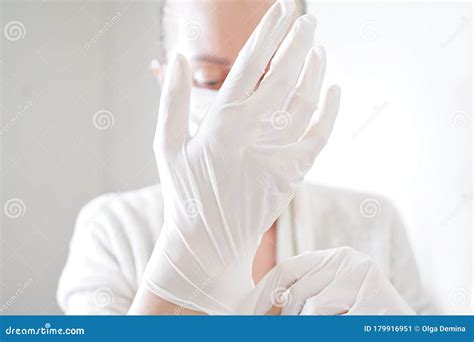 Hand with a Medical Face Mask and Medical Gloves for Protection Against ...