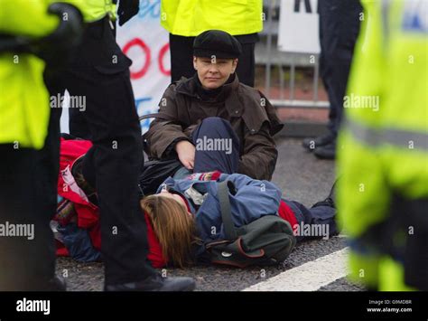 Protesters blocking the north Gate of Faslane Naval Base during a parliamentarian demonstration ...