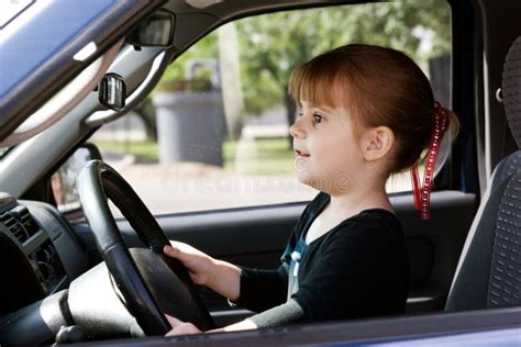 A girl driving a car stock photo. Image of black, honk - 5025492