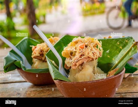 The vigoron typical food of Granada, Nicaragua. Traditional Vigoron in banana leaves served on a ...