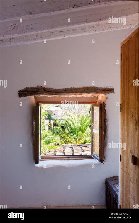 Rustic window with wooden shutters Stock Photo - Alamy