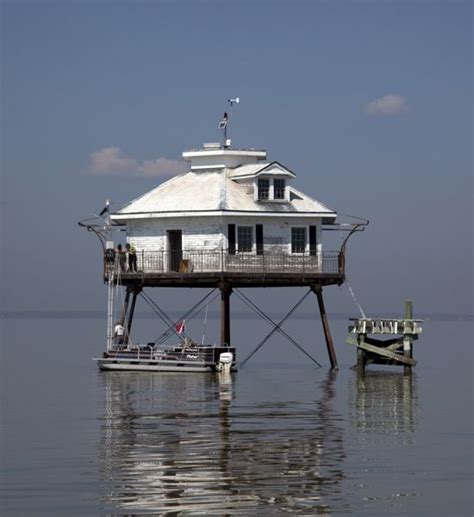 Middle Bay Lighthouse, Alabama. Rising from the center of Mobile Bay ...