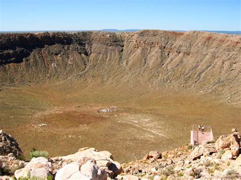 a large crater in the middle of a desert