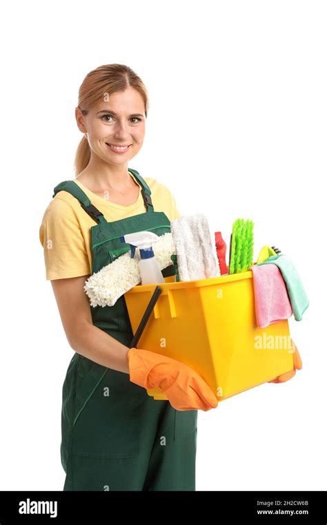 Female janitor with cleaning supplies on white background Stock Photo - Alamy