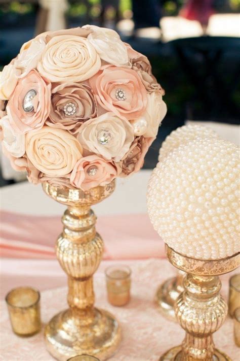 Ribbon roses make for pretty centerpieces. | Decoracion boda vintage ...