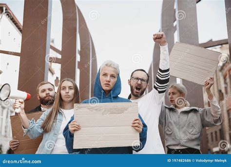 Group of Activists Giving Slogans in a Rally. Men and Women Marching ...