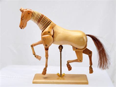 Premium Photo | Wooden articulated horse dummy for drawing lessons on ...