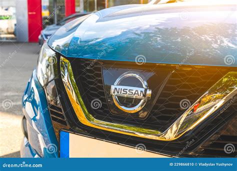 Nissan Brand Logo On Blue Sky Background, Banner, Emblem, Symbol Close-up Editorial Photo ...