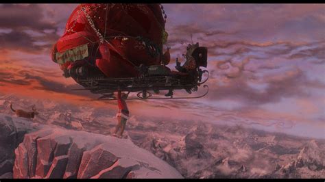 In "How The Grinch Stole Christmas" (2000) this scene shows the grinch is carrying a sleigh ...