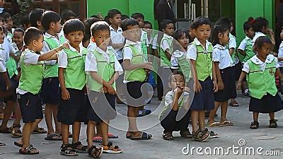 Siam Reap, Cambodia - January 12, 2017: Many Cambodian Schoolchildren from Junior Classes in ...