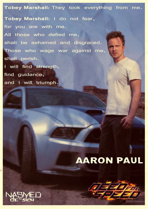 a man standing in front of a car with the words aaron paul written on it