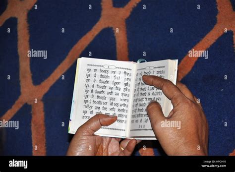 Reading the Sikhism scriptures. The scriptures of Sikhism are known as ...