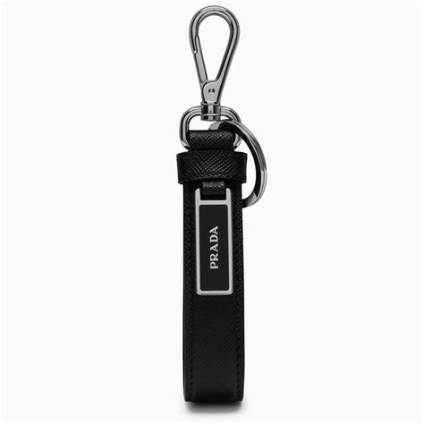 Black keychain by Prada, featuring carabiner, leather details and steel plaque with logo ...