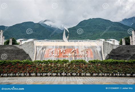 Dali University Sign at the Entrance of the Chinese Campus and Cangshan Mountains in Background ...