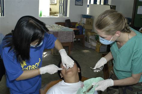 File:US Navy 040303-N-4958O-004 Filipino dentist Irma Villeta, left ...