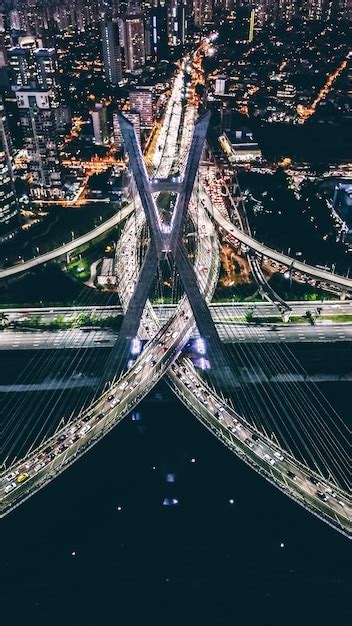 Premium Photo | Aerial view of illuminated bridges in city at night