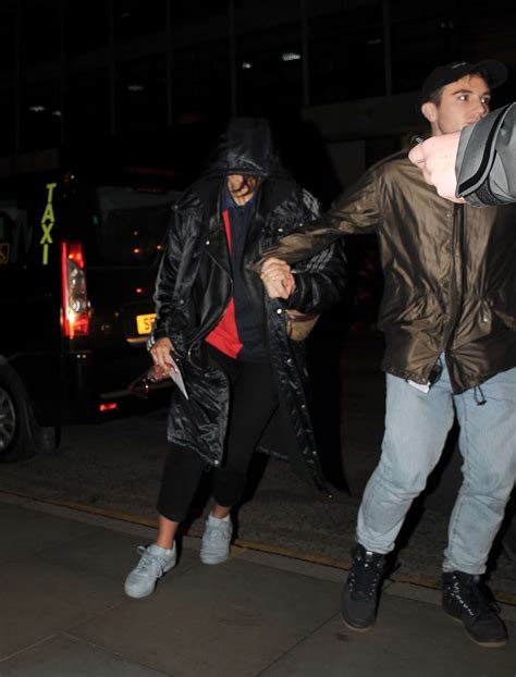 Dua Lipa: Hides from paparazzi in Manchester -02 | GotCeleb