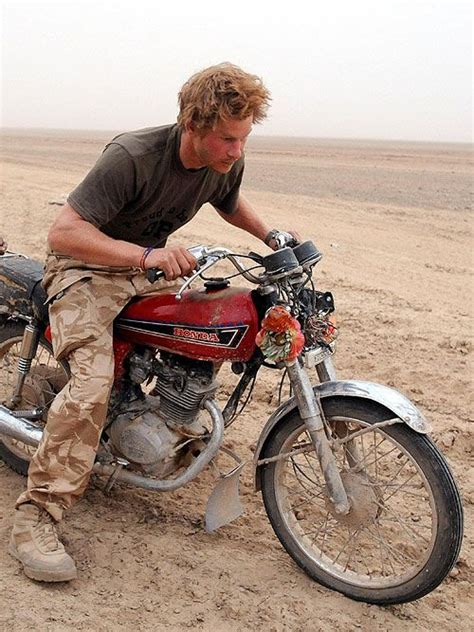 Rugged, vintage bike....and I believe this is Prince Harry.....or he ...