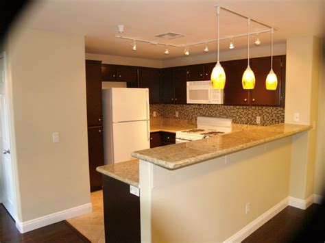 Kitchen Counter with place for bar stools | Track lighting kitchen ...